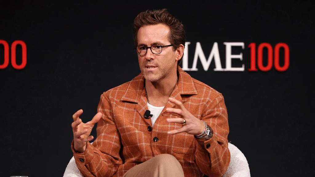 Ryan Reynolds holding his daughter during a casual outing