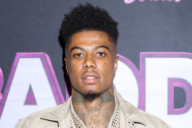 Blueface and his son Javaughn J. Porter at a public event