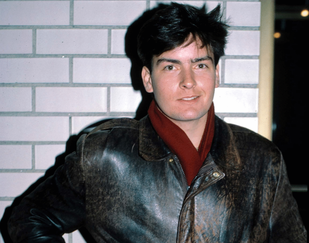 Charlie Sheen looking serious in a recent interview discussing finances and career